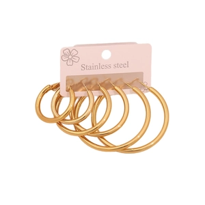 Three pairs of minimalist golden stainless steel hoop earrings in graduated sizes