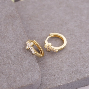 18K gold plated hoop earrings featuring micro-pave zircon cross pendants on stone surface