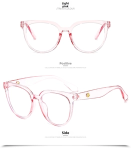Detail view of light pink oversized transparent frames with gold rivet accents