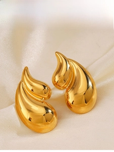 Detailed macro view of 18K gold plated teardrop earrings on elegant silk background