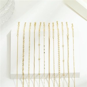 Collection of minimalist gold necklaces in various styles for jewelry DIY and accessory use