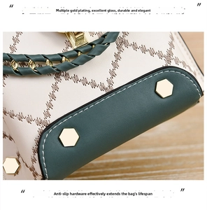 Detail of multi-plated gold hardware and anti-slip rivets on ivory quilted mini bag