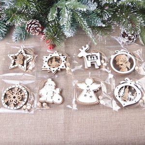 Set of 8 hollow wooden Christmas tree ornaments with snow-dusted pine needles