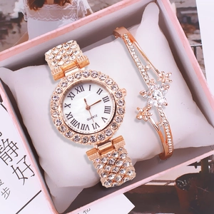 Close-up of rose gold quartz watch and matching floral rhinestone bracelet in gift box
