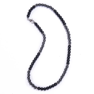 Close-up of 6mm matte black map stone necklace with silver metallic spacer beads