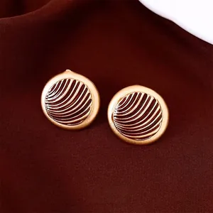 French vintage round gold earrings with sunburst texture and dark enamel inlay