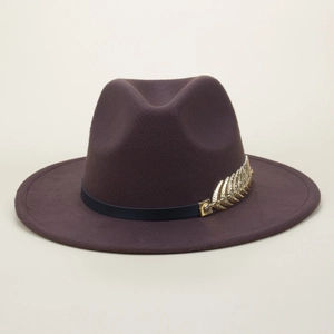 Close-up of a wide-brim wool fedora hat featuring a gold leaf buckle on a leather band