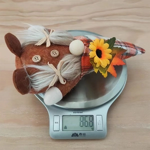 Detail shot of 86.8g plush gnome on a digital scale showing product weight