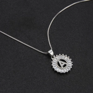 Silver letter A pendant necklace with sparkling cubic zirconia stones on black background