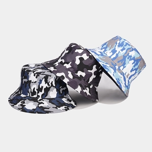 Detailed view of three camouflage bucket hats in navy, classic grey, and light blue colors