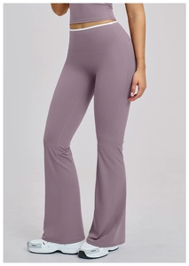 Detail of high-waist flared yoga leggings with white contrast trim and lavender fabric