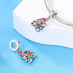 Silver-plated Halloween flower bead charm with red enamel accents on a bracelet