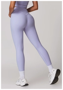Detail view of high waisted lavender yoga pants featuring a sculpting V-shape back seam