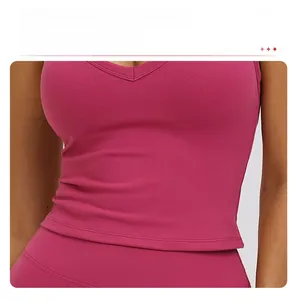 Detailed view of longline rose pink yoga vest with slimming waist and fine stitching