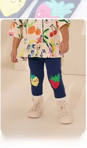 Detail of navy leggings for girls featuring cute strawberry and lemon fruit patches