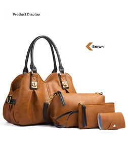 Detailed view of 4-piece vintage brown faux leather bag set with tote and crossbody