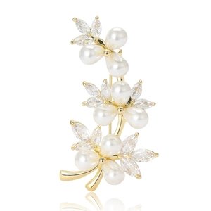 Elegant gold vine brooch featuring white pearls and marquise-cut zircon flowers on white background