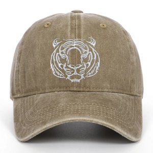Close-up of white tiger head embroidery on khaki washed cotton baseball cap
