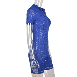 Detailed close-up of blue cut-out knit bodysuit with front zipper on mannequin