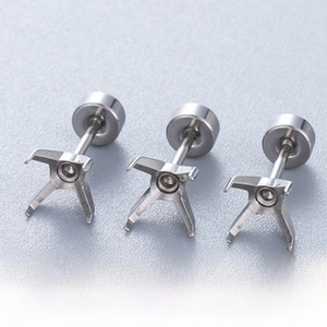 Macro detail of titanium steel four-prong earring studs with secure screw-back closure