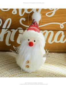 Detail of plush Santa Claus doll with red knitted hat and natural wooden buttons