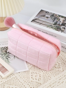 Macro detail of quilted velvet cosmetic bag showing large capacity and soft texture