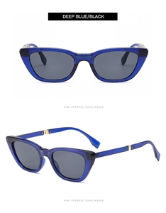 Detail view of foldable cat-eye sunglasses with metal hinges and deep blue frames