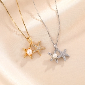 Starfish pendant necklace with pearls and zircon crystals in gold and silver finish