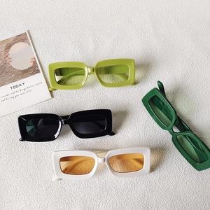 Trendy square frame sunglasses in four assorted colors on a textured white background