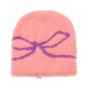 Detail of pink plush beanie showing soft faux mink texture and purple bow pattern