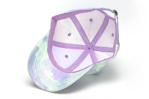 Close-up showing the purple inner lining of an iridescent tie-dye kids baseball cap