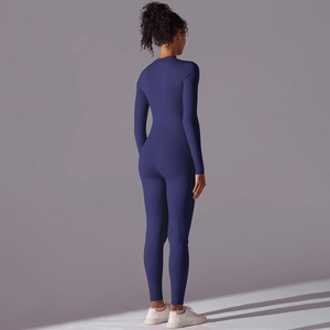 Rear view of the dark blue long sleeve yoga bodysuit showing tight fit and back seam detail