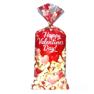 Close-up of Valentine's Day OPP gift bag with red hearts and golden twist tie closure
