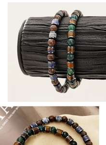 Macro detail of natural agate and snowflake stone beaded bracelets for men with metal spacers