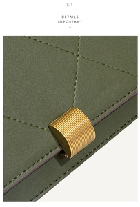 Macro detail of dark green quilted leather texture and golden metal buckle on handbag
