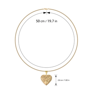 Macro shot of gold heart locket pendant with tree of life relief and size measurements