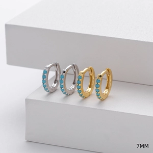 Detail of 7mm 925 sterling silver hoop earrings in gold and silver with turquoise stones