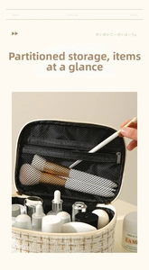 Interior view of tweed cosmetic bag showing layered compartments and mesh brush pocket