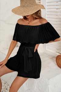 Close-up of black off-shoulder pleated jumpsuit with matching tie-waist belt detail