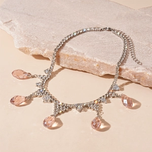 Elegant silver necklace with sparkling rhinestones and champagne teardrop pendants