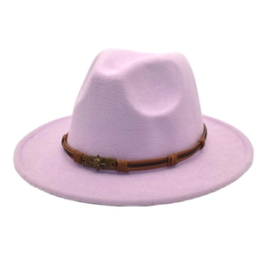Close-up of lilac wool felt jazz hat featuring brown leather band and skull accent