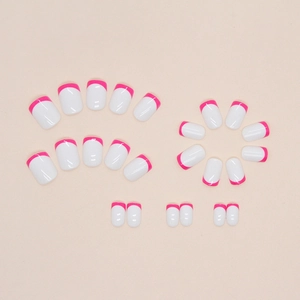 Short round French press-on nails with white base and vibrant rose pink tips