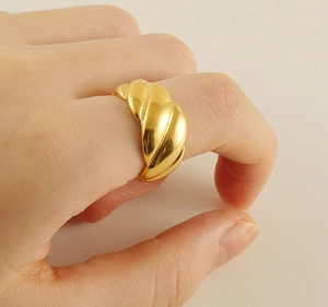 Detailed view of women's gold 18k plated stainless steel ring with textured spiral design