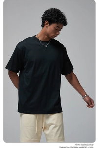 Close-up of oversize black cotton T-shirt with retro and innovative text detail