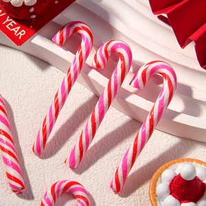 Close-up of pink and red striped Christmas candy canes for DIY crafts and decor