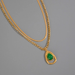 Double layer gold necklace with green aventurine drop pendant and Figaro snake chain