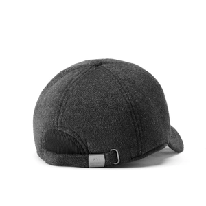 Detail of dark grey wool blend winter cap featuring a metal buckle and ribbed stitching