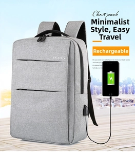 Waterproof grey business backpack showing external USB charging port connected to a smartphone