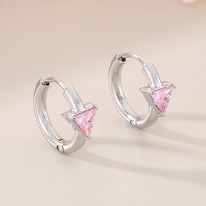 Detail of silver hoop earrings with pink triangle zircon in 18K vacuum plating