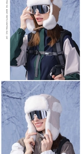 Detail view of thickened beige winter trapper hat with warm white faux fur lining